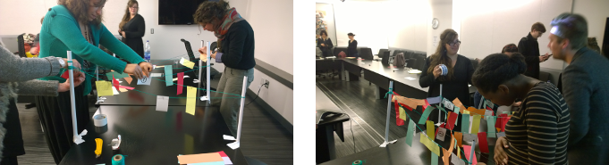 Personnes accrochant des petits papiers colorés à des cordes